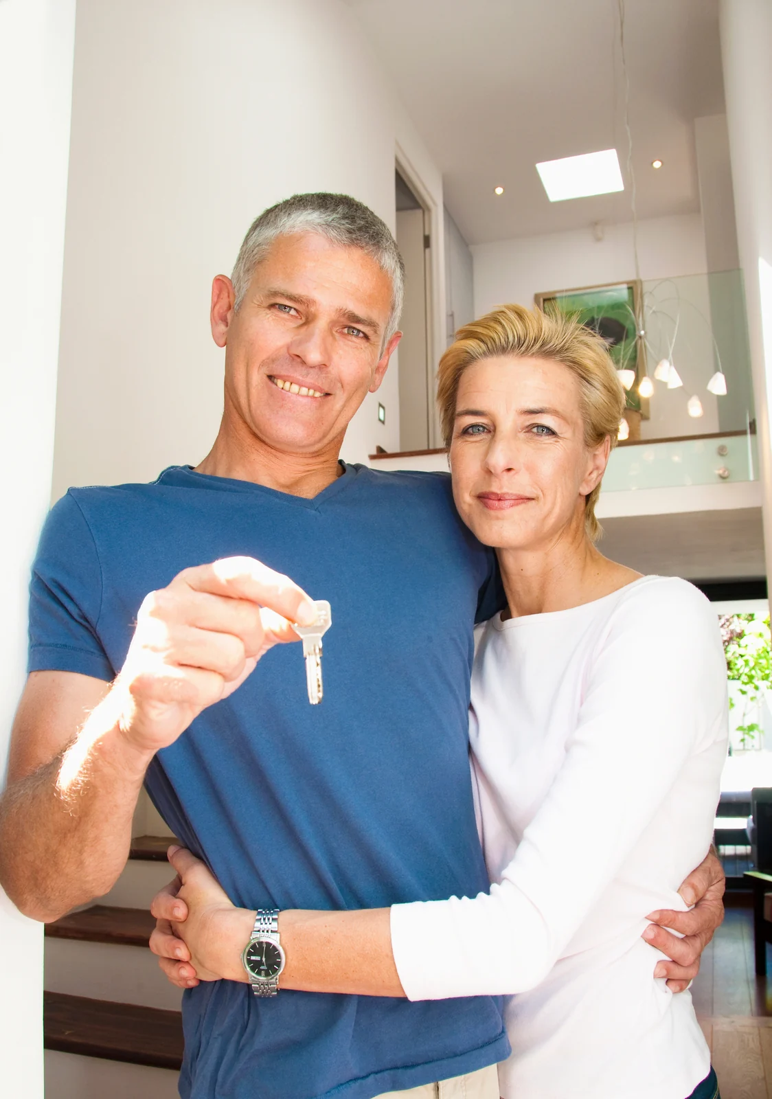 New homeowners holding the keys to their property
